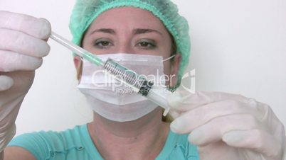 Doctor preparing syringe