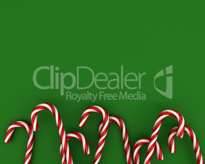 Christmas candies on green background