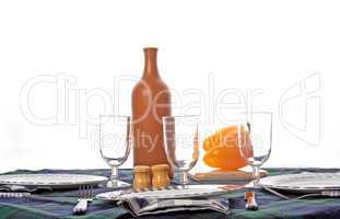 Table with bottle, glasses and pepper isolated on white background