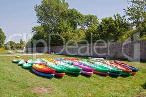 kayaks lying on the grass