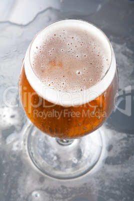 Glass with beer and foam