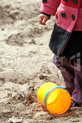 Kid's hand and toy bucket