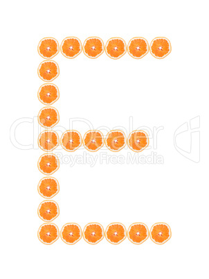 Letter "E" from orange slices isolated on white