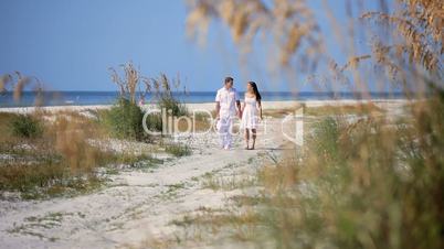 Young Couple Walking the Beach