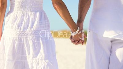 Contented Couple Walking the Beach