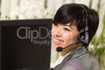 Attractive Young Woman Smiles Wearing Headset