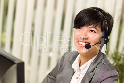 Attractive Young Woman Smiles Wearing Headset