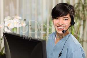 Attractive Multi-ethnic Young Woman Wearing Headset and Scrubs