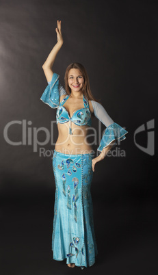 young woman dance in blue arabian costume