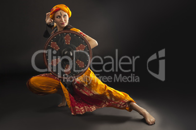 woman posing with shield - arabia theme