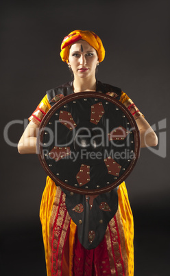 woman posing with shield - arabia theme