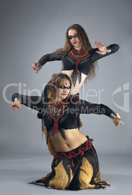 Two woman dance in warrior cosutme