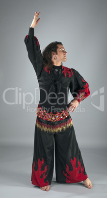 Man dance in traditional arabian costume