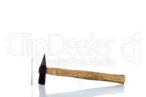 Old rusty hammer with reflection - isolated over white
