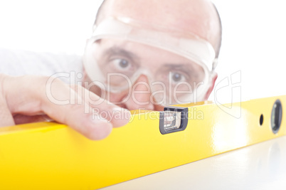 Man working with a yellow bubble level