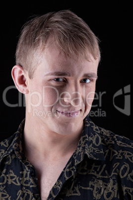 smiling young man in shirt look at you