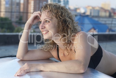 Young woman on roof Young woman on roof
