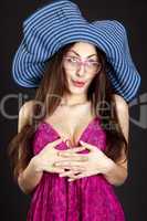 Pretty young girl face in hat and glasses