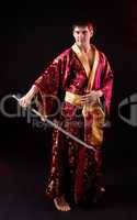 man holding samurai sword