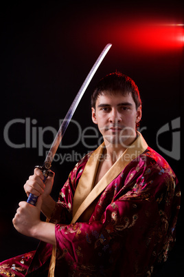 man holding samurai sword