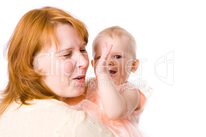 Baby playing with mother