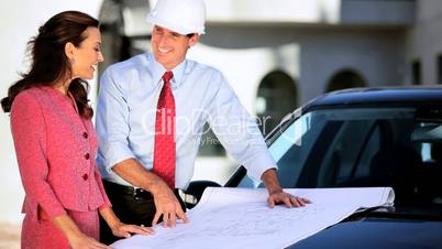 Architect & Client Approving Plans