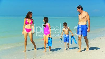 Healthy Family in Swimwear on the Beach