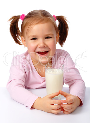 Little girl with a glass of milk