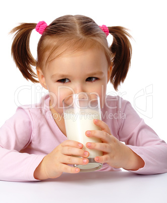 Little girl drinks milk