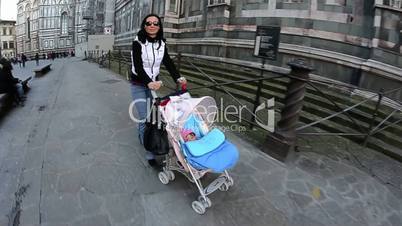 Mother with Daughter on the Stroller in Florence