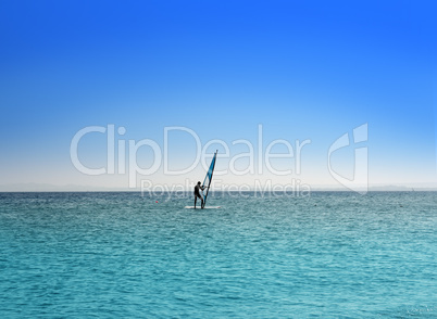 surfer on blue sea under sky