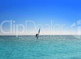surfer on blue sea under sky