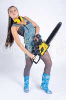 Pretty girl with chainsaw