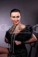 Proud woman smile in fur boa with pearl beads