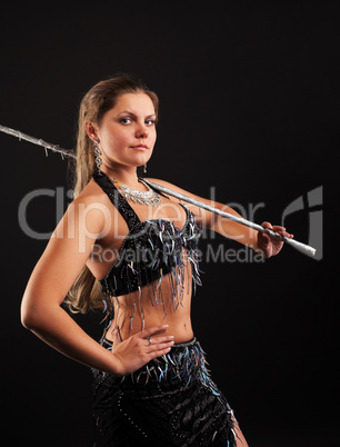 woman dance in oriental arabia costume with cane