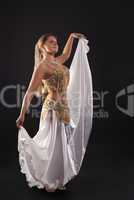 young woman dance in dark - white arabian costume