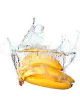 Bunch of bananas in water splash isolated on white