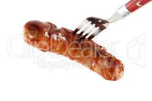 Fried sausage on a fork