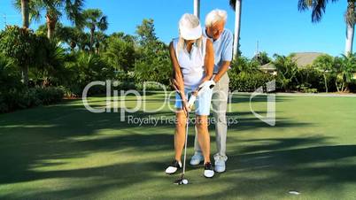 Mature Lady Learning to Play Golf