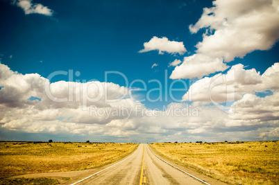 vibrant image of highway and blue sky