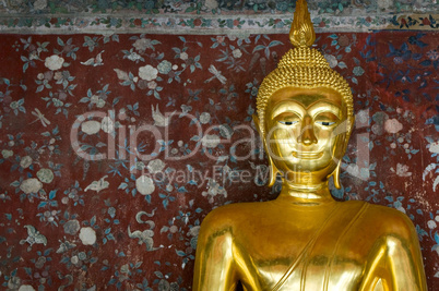 golden buddha over grunge wall