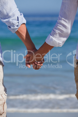 Enamored couple looking at the sea