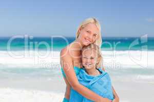 Mother with her daughter in her towel