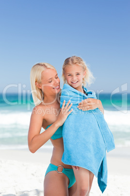 Mother with her daughter in her towel