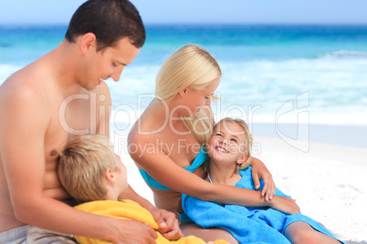 Parents with their children in their towels