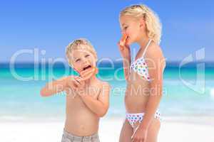 Brother and sister eating an ice cream