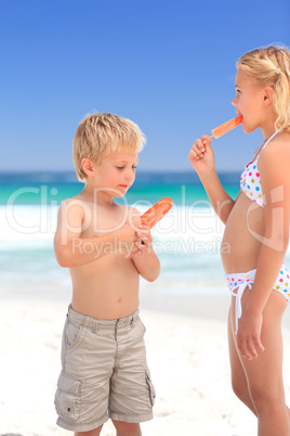 Brother and sister eating an ice cream