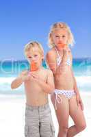 Brother and sister eating an ice cream