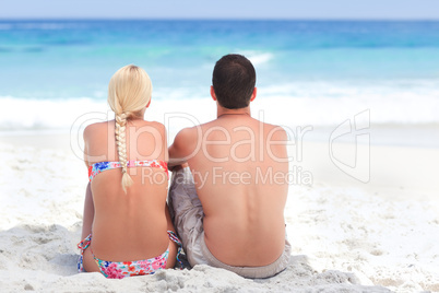 Man and  his girlfriend  looking at the sea