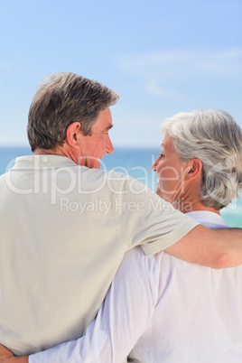 Senior couple looking at the sea